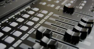 Mixing console track faders.