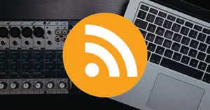An RSS icon in front of a MacBook and an audio mixer.