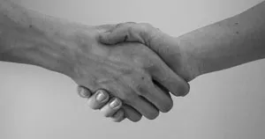Two people shaking hands.