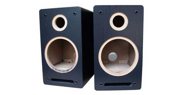 An image of two empty speaker cabinets.