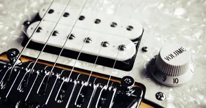 The pickups of an electric guitar.