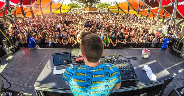 A DJ performing in front of a crowd.