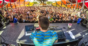 A DJ performing in front of a crowd.