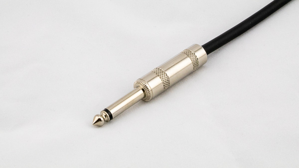 An image of a guitar/instrument cable with a 1/4" TS phone plug connector.