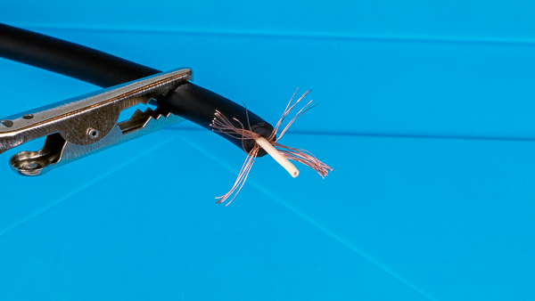 An image of an instrument cable with the inner ground wire pulled back.