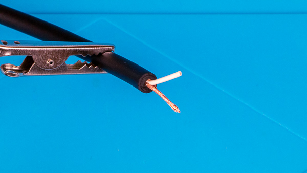 An image of an instrument cable with the inner ground wire braided together.